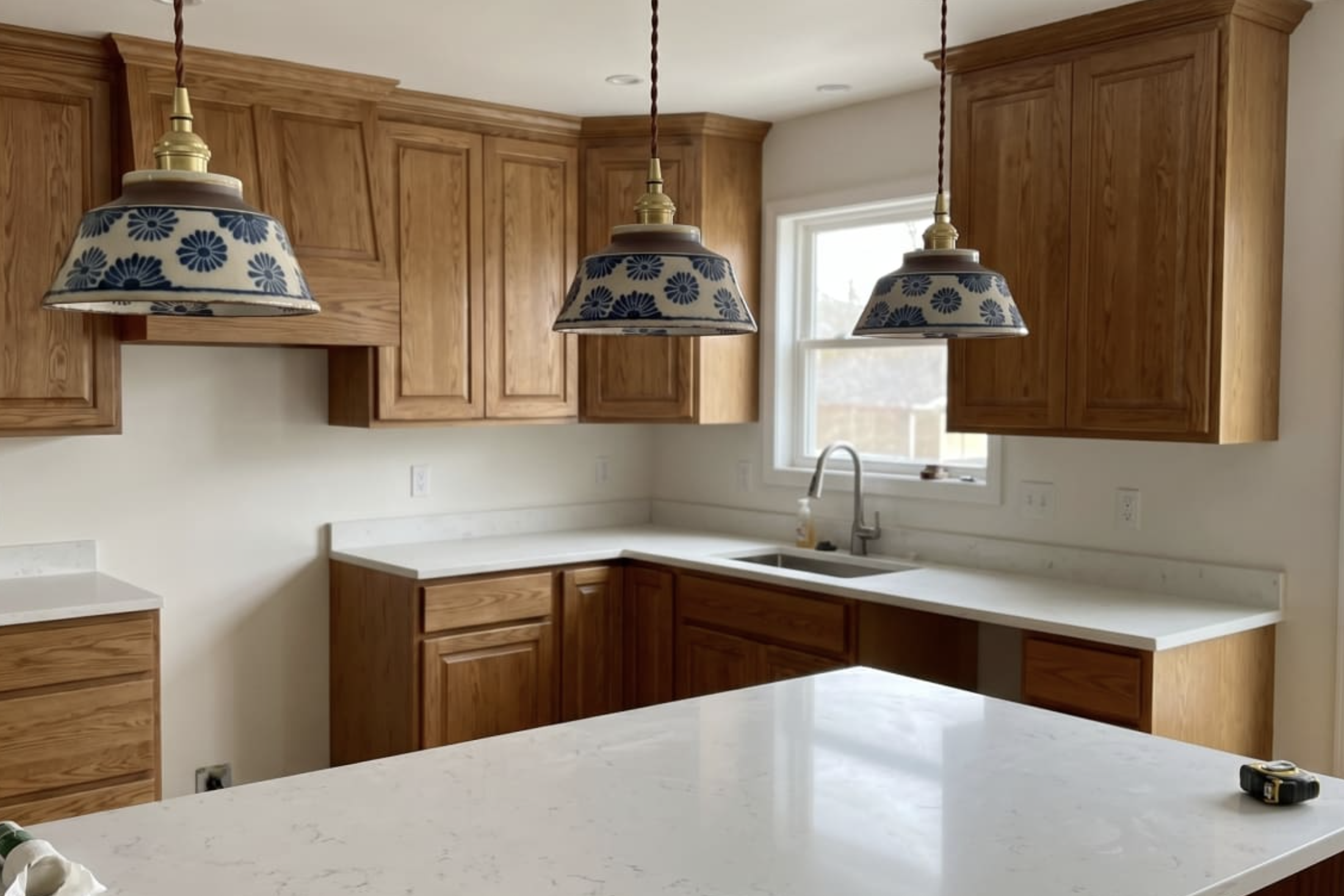 BO-HA Ronja hand-painted ceramic pendant lights over a kitchen island